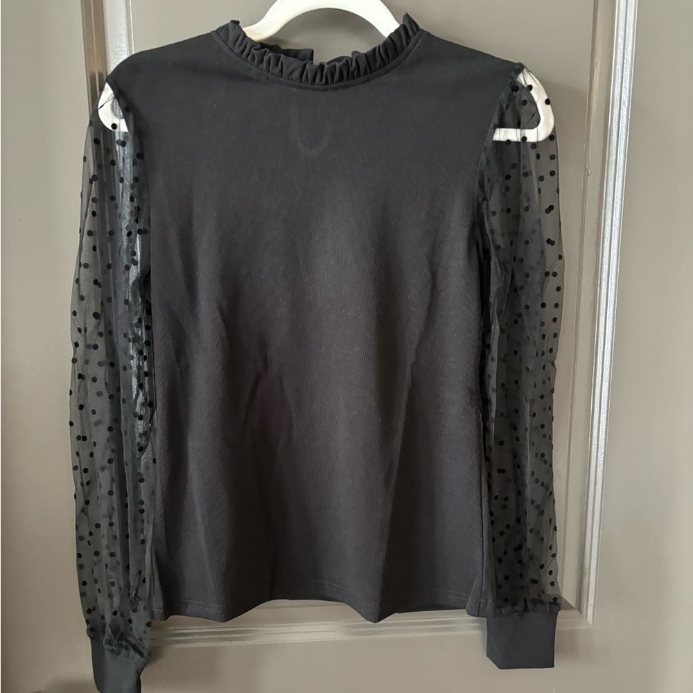 Black top with sheer polka dot sleeves size medium